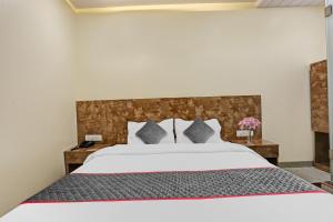 Postel nebo postele na pokoji v ubytování Hotel O Kiwi International