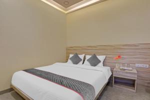 Postel nebo postele na pokoji v ubytování Hotel O Kiwi International