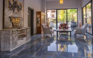 a living room with chairs and a table at ADA BOUTİQUE HOTEL in Marmaris +7 photos
