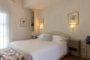 Cama ou camas em um quarto em Dorion Hotel