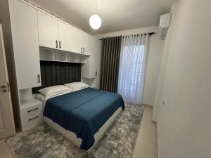 Ένα ή περισσότερα κρεβάτια σε δωμάτιο στο Albania,Tirana,Kamëz +1 φωτογραφίες