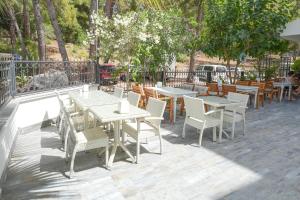 a group of tables and chairs on a patio at ADA BOUTİQUE HOTEL in Marmaris