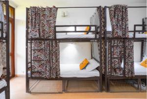 Ein Bett oder Betten in einem Zimmer der Unterkunft Hide-In Hostel Delhi