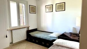 Ένα ή περισσότερα κρεβάτια σε δωμάτιο στο N084 - Numana, villa quadrilocale con meraviglioso giardino +33 φωτογραφίες