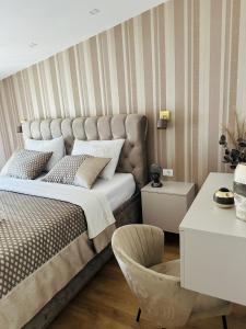 En eller flere senge i et værelse på VILLA PADRE