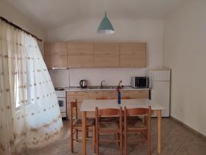 Kuchyň nebo kuchyňský kout v ubytování Rooms Xani