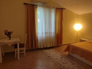 Postel nebo postele na pokoji v ubytování Rooms Xani + 12 fotografií