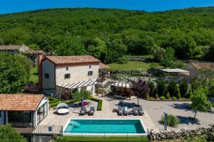 an aerial view of a house with a swimming pool at Villa Veselici in Labin