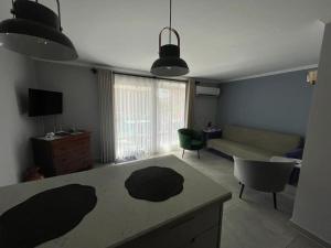 a living room with a couch and a table at Kalkan lovely 1 bedroom holiday rental in Kas