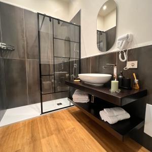 a bathroom with a sink and a shower at Relais Villa Migliorini in Ercolano