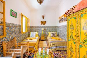 Postel nebo postele na pokoji v ubytování Riad Dar Tiflet