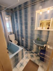 a bathroom with a sink and a tub and a toilet at Sobe Đakovački vezovi in Đakovo +38 photos