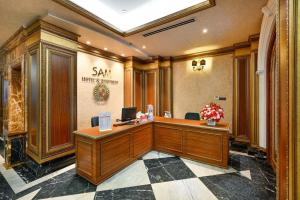 a lobby with a reception desk in a building at Sam Royal Apartment in Ho Chi Minh City