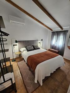a bedroom with a large bed in a room at El Rincón de Manuela By Travel Home in El Cardete