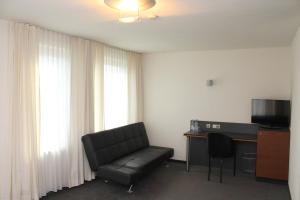 TV a/nebo společenská místnost v ubytování Hotel am Hirschgarten