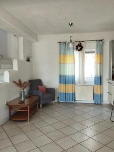 a living room with a couch and a table at V.K.Seaside Villa in Volos