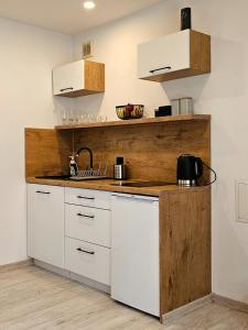 Kuchyňa alebo kuchynka v ubytovaní Apartament Słoneczne Okno