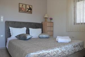 Posteľ alebo postele v izbe v ubytovaní Depie Luxury Apartment in Pastida Rhodes