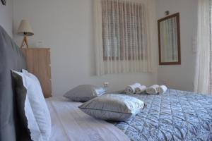 Posteľ alebo postele v izbe v ubytovaní Depie Luxury Apartment in Pastida Rhodes