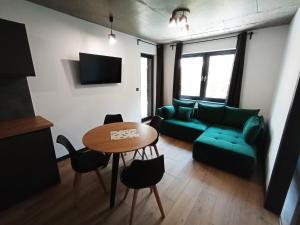 Posezení v ubytování APARTAMENTY PIASKOWE BŁĘKITNA