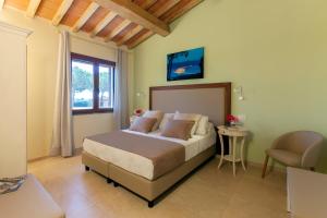 Postel nebo postele na pokoji v ubytování Resort Capalbio