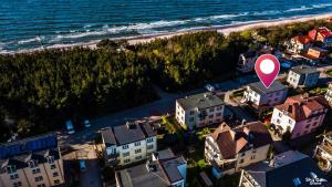 an aerial view of a beach with a red marker at Leokadia przy plaży kwatery prywatne in Mielno