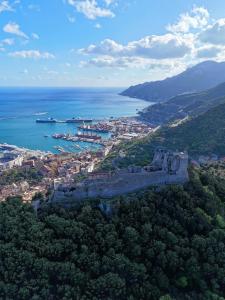 an aerial view of a city and the ocean at I 7 MARI home in Salerno