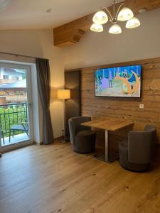 Televiisor ja/või meelelahutuskeskus majutusasutuses Sagebruenndle Appartements