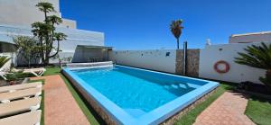 a swimming pool in the backyard of a house at Quiet area - Terrace - Pool - Parking - Aduls only in Tías