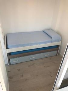 a small bed in a small room with a mattress at Carihuela Beach in Torremolinos