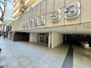 a large building with a sign on the side of it at Hermoso departamento monoambiente en edificio MARAL 33 in Mar del Plata