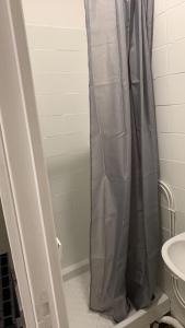 a shower curtain in a bathroom with a sink at Studio au centre Aubusson in Aubusson