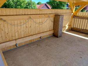 a wooden fence with a chain attached to it at Weserberglandalm Haus 3 in Ottenstein