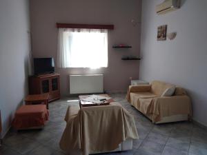 TV a/nebo společenská místnost v ubytování Kimi apartments