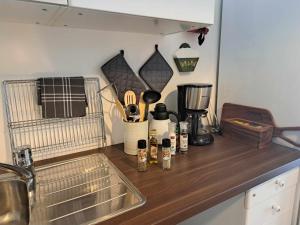 a kitchen counter top with a sink and a counter top at Haukeli hotell leilighet in Haukeligrend