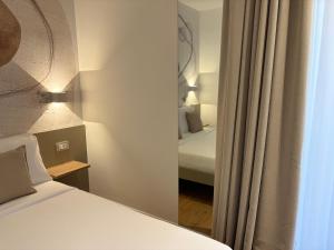 Letto o letti in una camera di Robely rooms