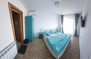 Postel nebo postele na pokoji v ubytování Casa Țache