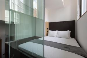Cama o camas de una habitación en The Z Hotel City