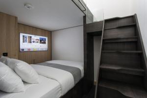 Cama o camas de una habitación en The Z Hotel City