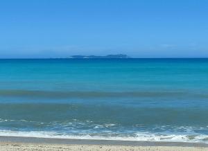 a view of the ocean from the beach at Dolphin Apt & Studios -Near the Beach in Roda