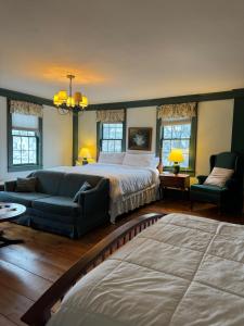 a large bedroom with a bed and a couch at Chester Inn in Chester