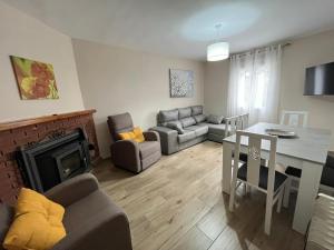 a living room with a couch and a table at El Olivar de la Solana in Castril