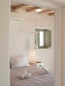 Posteľ alebo postele v izbe v ubytovaní Donum Dei Seaside Suites & Villa