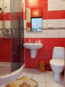a bathroom with a sink and a toilet and a shower at Apartament i pokoje u Roberta in Polańczyk +112 photos