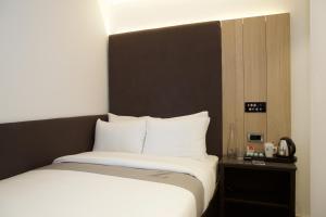 Cama o camas de una habitación en The Z Hotel City