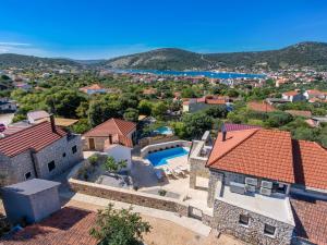 an aerial view of a house with a swimming pool at Villa Mare in Vinišće