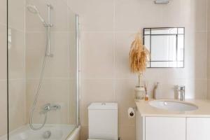 a bathroom with a shower and a toilet and a sink at Happy Tucan in Larnaka +41 photos