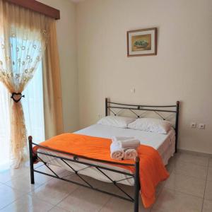 A bed or beds in a room at Bellavista House in Monolithos Rhodes