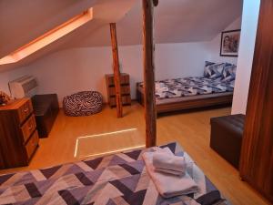 a room with a bunk bed and a couch at Къща за гости Бели Вит in Ribarica +36 photos