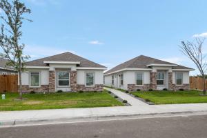 a house on a street with a fence at Peaceful & Cozy Hideaway Unit #1 in Edinburg